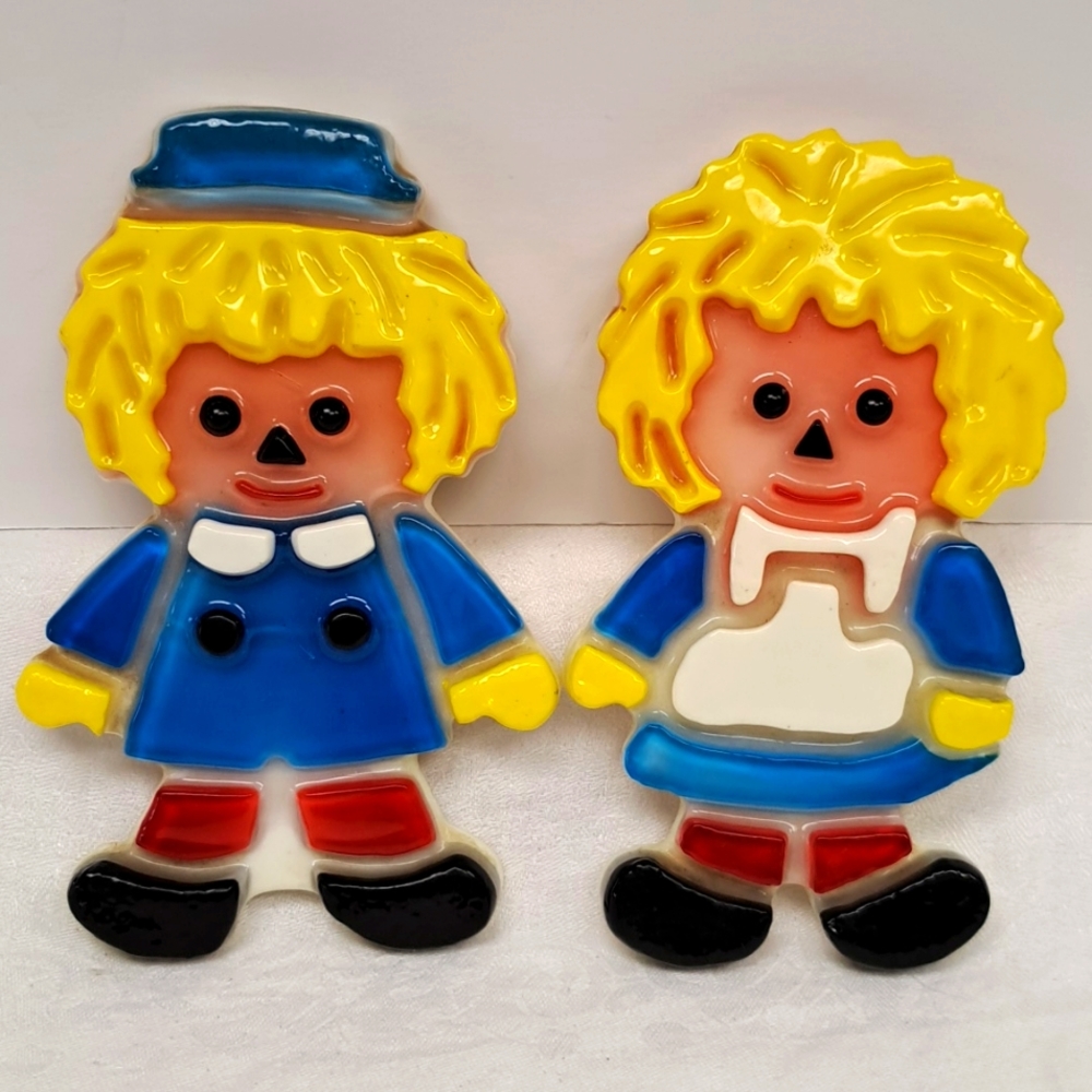 Vintage lucite Raggedy Ann and Andy wall plaques